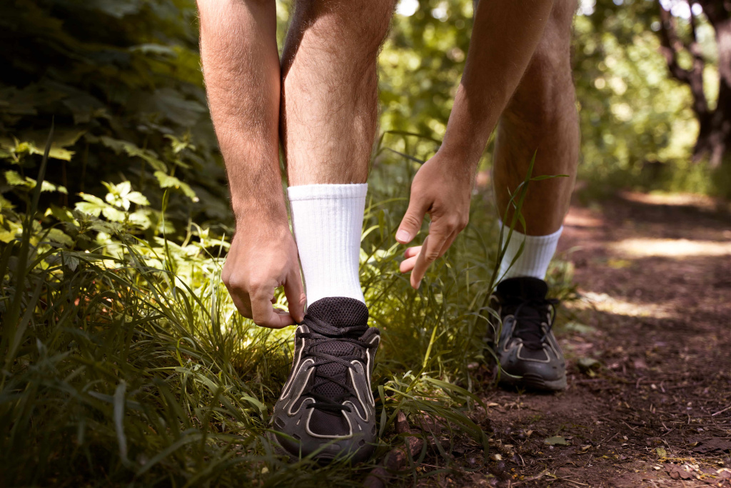 front-view-man-tying-shoelaces (1).jpg front-view-man-tying-shoelaces (1).jpg